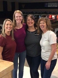 Group of women representing the Home Builders Association of Billings at an event.