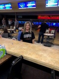 A woman smiling at the Home Builders Association of Billings event.