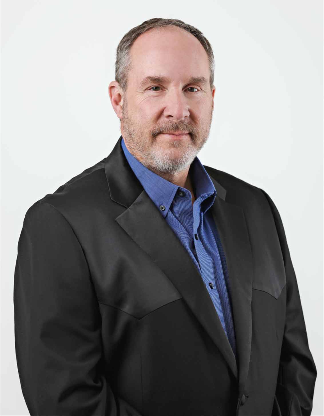 Professional man in business suit representing Home Builders Association of Billings.